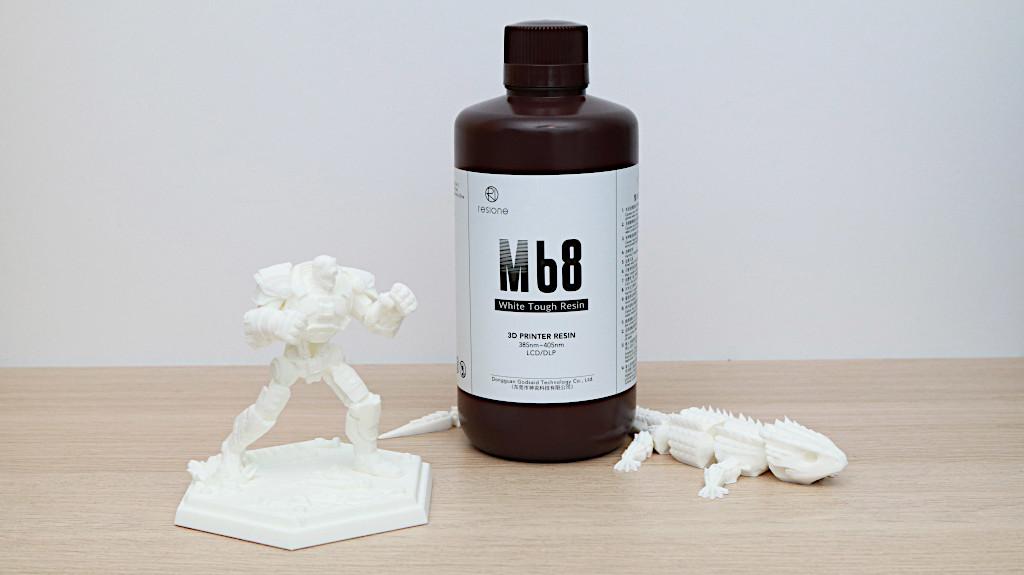 Bottle of White Resin and 3D Prints