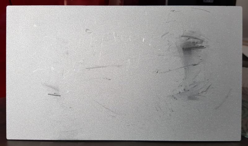 Spatula marks on a build plate