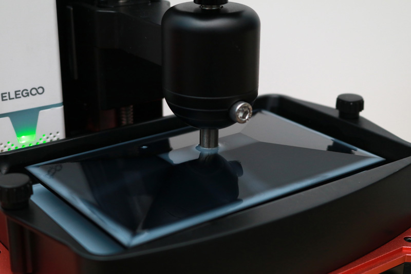 Build plate covered in liquid resin
