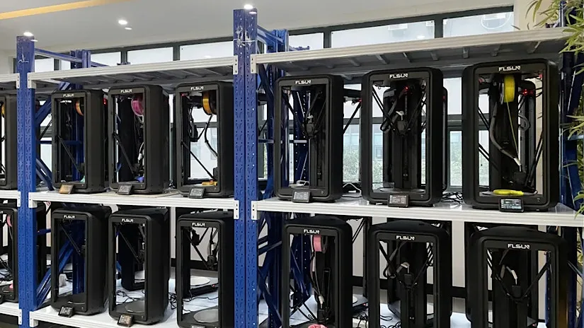 Multiple FLSUN T1 3D printers installed on industrial shelves in a print farm setup