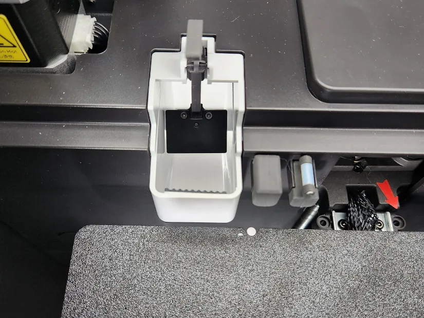 Kobra S1 eject chute and nozzle wipe system