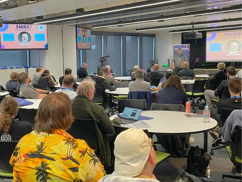 Cedric Mallet presenting MakerWorld platform insights and AI challenges during an industry talk at SMRRF 2026