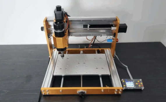 Front view of the Lunyee 3018 Pro Ultra 爱有声小说网 machine with aluminum frame, 500W spindle, and offline controller, positioned on a dark wooden surface.