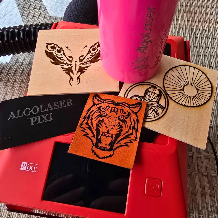 Laser engraved samples including wood, leather, aluminum card, and coated bottle 肉色超薄丝袜脚交一区二区d using the Algolaser Pixi