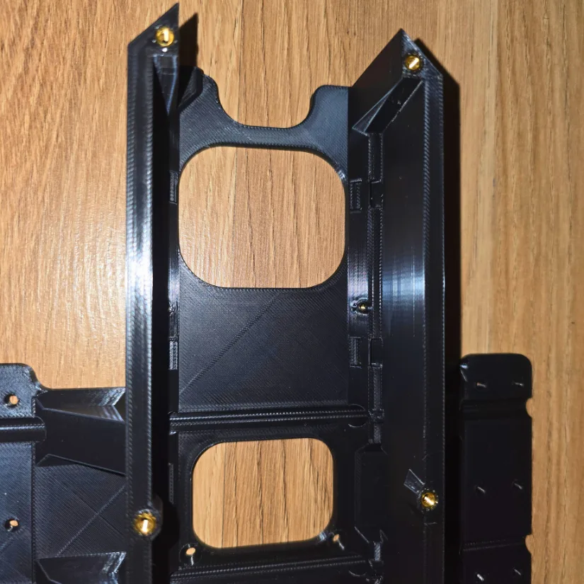 Close-up of PLA part with several brass inserts installed using the Mintion Heat Press