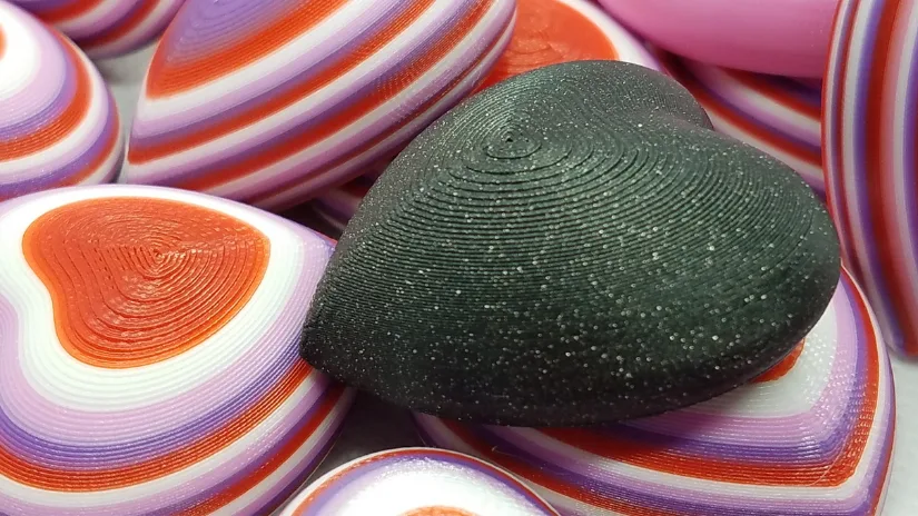 3D printed Valentine heart magnets prepared for classroom Valentine exchanges
