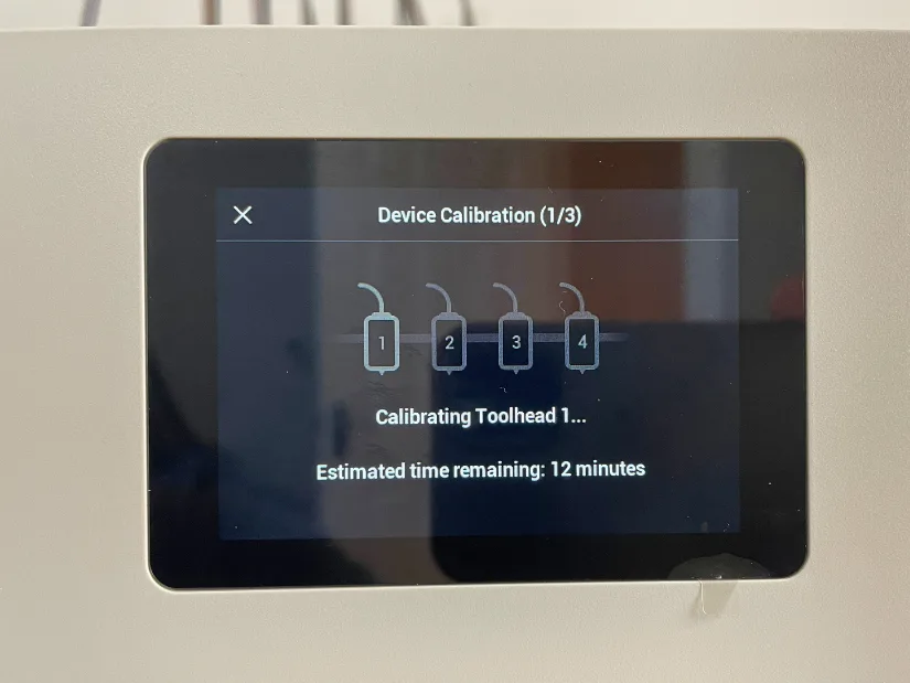 Touchscreen showing toolhead kaobi process with estimated time remaining